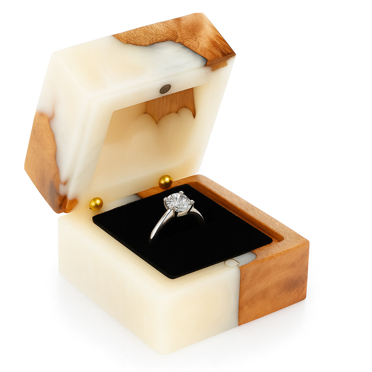 Open onyx and wood ring box with black velvet interior holding engagement ring