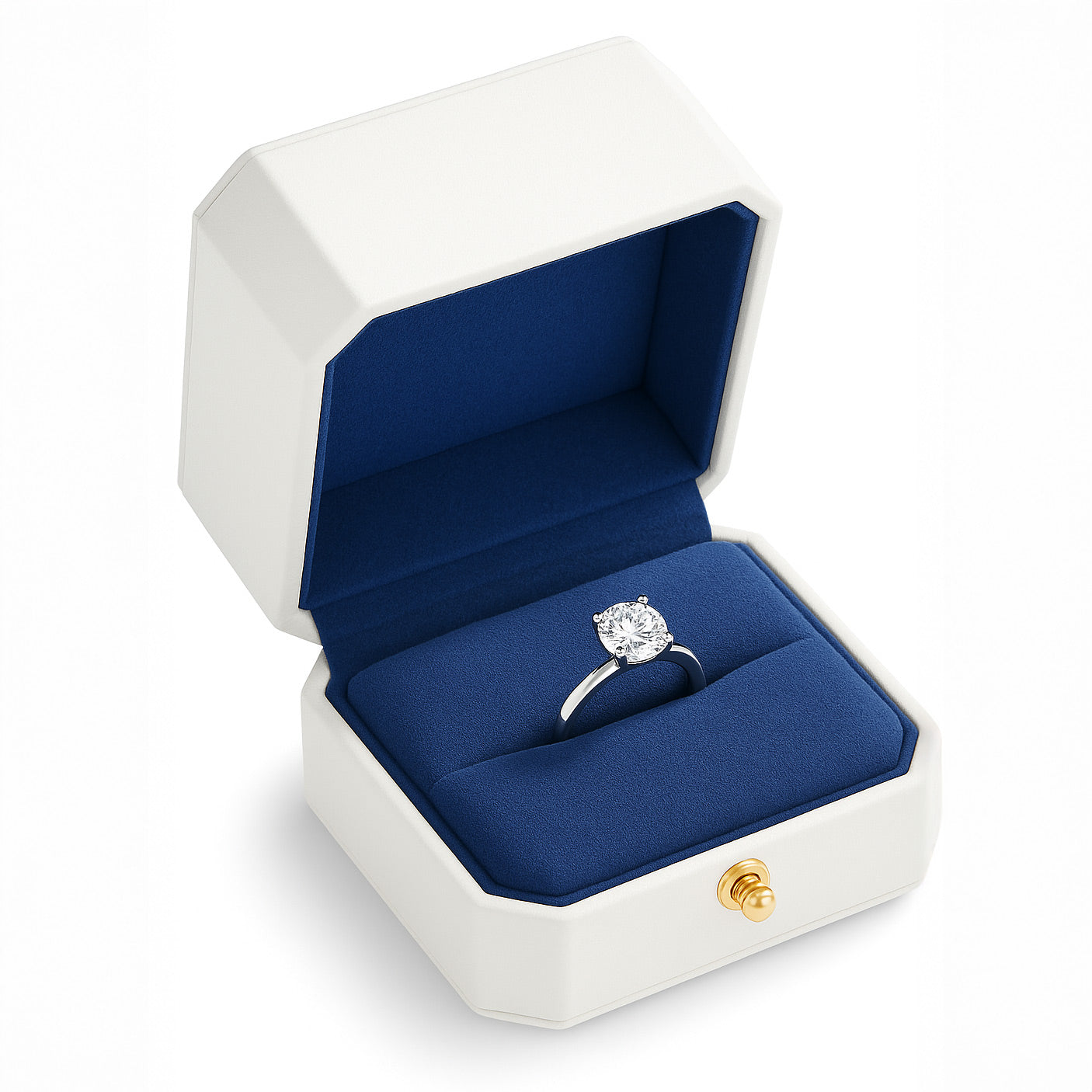Open white luxury ring box with blue velvet interior holding engagement ring